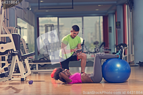 Image of pilates  workout with personal trainer at gym