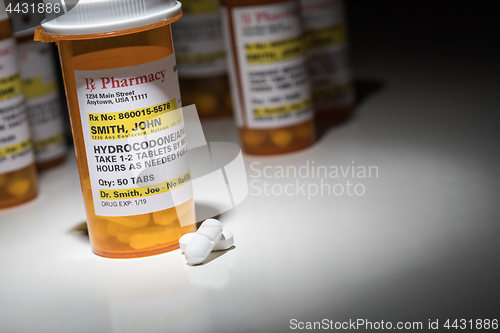 Image of Hydrocodone Pills and Prescription Bottles with Non Proprietary 