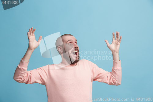 Image of Winning success man happy ecstatic celebrating being a winner. Dynamic energetic image of male model