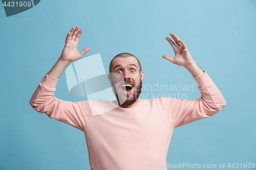 Image of Winning success man happy ecstatic celebrating being a winner. Dynamic energetic image of male model