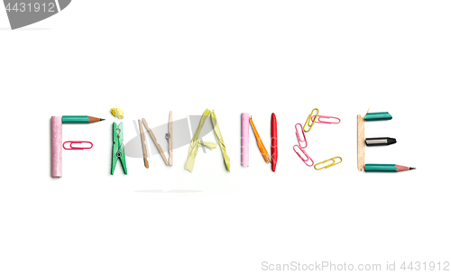 Image of The word finance created from office stationery.