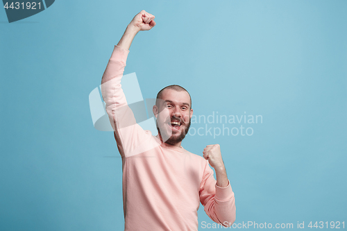 Image of Winning success man happy ecstatic celebrating being a winner. Dynamic energetic image of male model