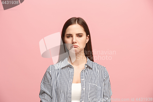 Image of Beautiful woman looking suprised and bewildered isolated on pink