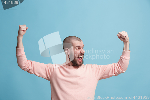 Image of Winning success man happy ecstatic celebrating being a winner. Dynamic energetic image of male model