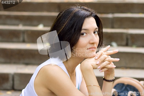Image of pretty woman sitting on a staircase
