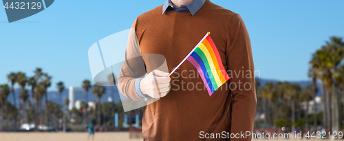 Image of close up of man with gay pride rainbow flag