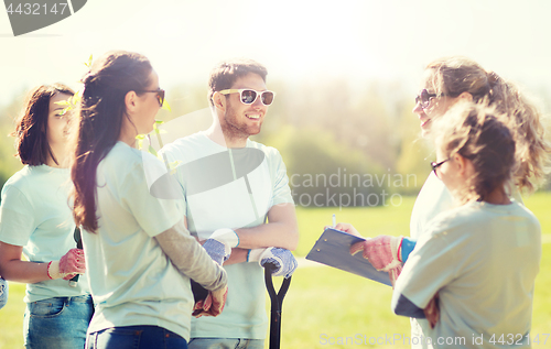 Image of group of volunteers planting trees in park