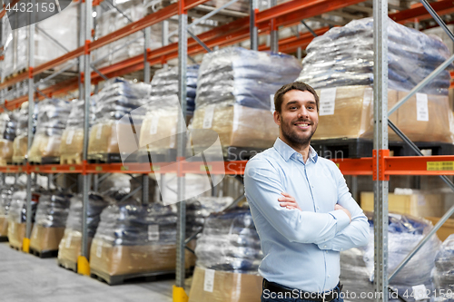 Image of happy businessman at warehouse