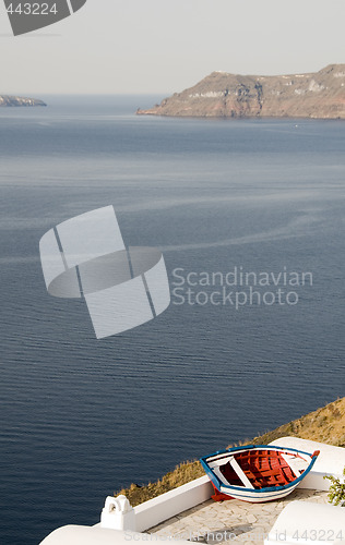 Image of old fishing boat over harbor oia ia santorini greek island