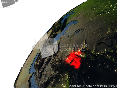 Image of Tajikistan in red on Earth at night