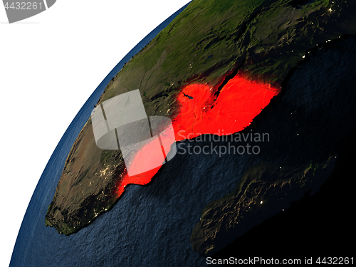 Image of Mozambique in red on Earth at night