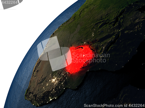 Image of Zimbabwe in red on Earth at night