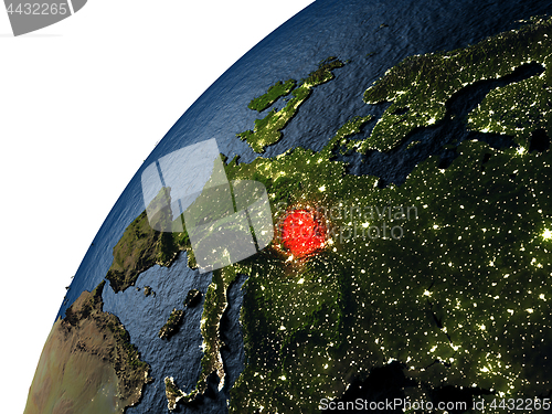 Image of Czech republic in red on Earth at night