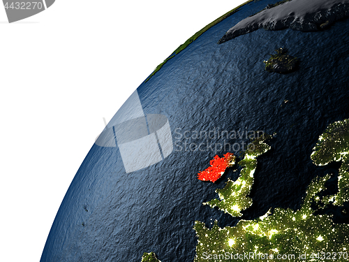 Image of Ireland in red on Earth at night