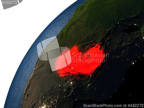 Image of Zambia in red on Earth at night