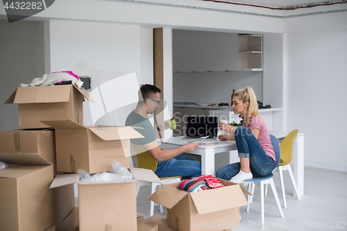 Image of Young couple moving in a new home