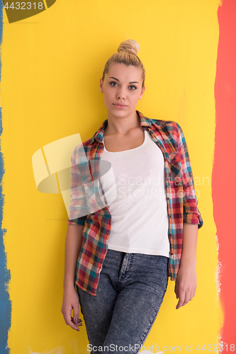 Image of young woman over color background