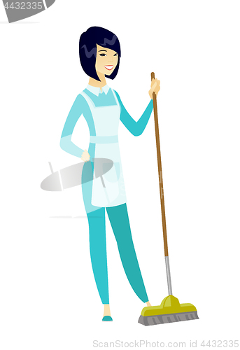 Image of Young housemaid sweeping floor with a broom.
