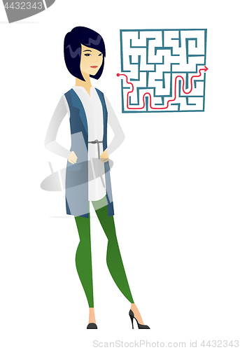 Image of Business woman looking at labyrinth with solution