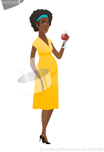 Image of Young pregnant woman holding a glass of wine.