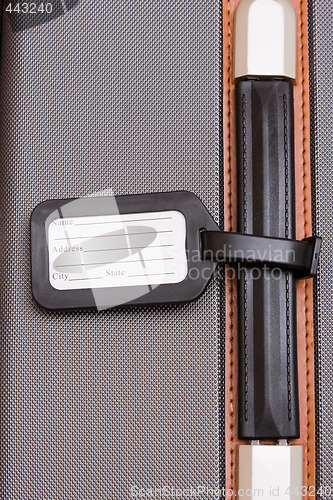 Image of Black Luggage Tag On Baggage