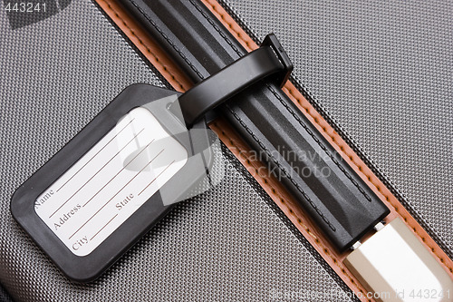 Image of Black Luggage Tag On Baggage