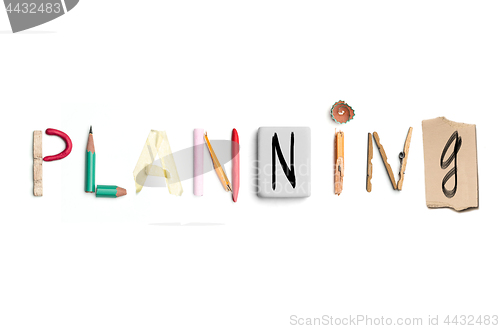 Image of The word planning created from office stationery.