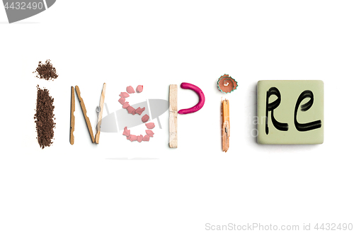 Image of The word inspire created from office stationery.