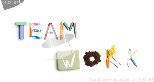 Image of The words team work created from office stationery.