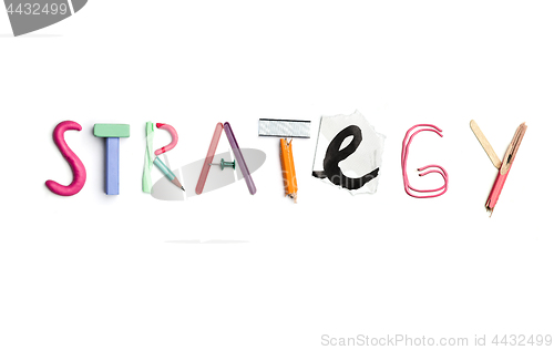 Image of The word strategy created from office stationery.