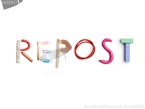 Image of The word repost created from office stationery.