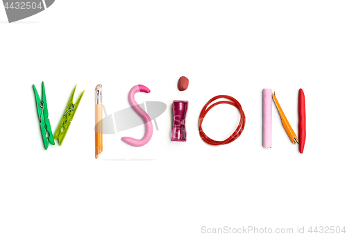 Image of The word vision created from office stationery.