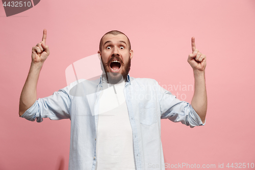 Image of Winning success man happy ecstatic celebrating being a winner. Dynamic energetic image of male model