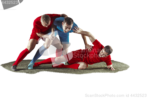 Image of Football players tackling for the ball over white background