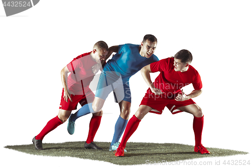 Image of Football players tackling for the ball over white background