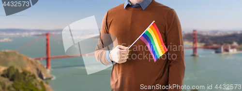 Image of close up of man with gay pride rainbow flag