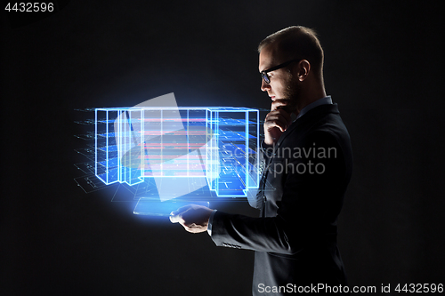 Image of man with tablet and virtual construction project