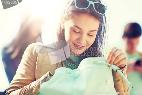 Image of high school student girl with backpack outdoors