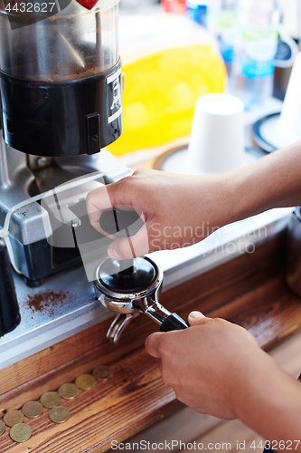 Image of Barista pouring milk in cup