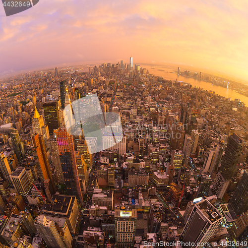 Image of New York City skyline with Manhattan skyscrapers at dramatic stormy sunset, USA.