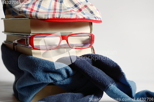 Image of Reading glasses with books and neckerchief