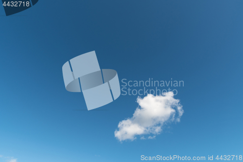 Image of Summer sky with one fluffy cloud