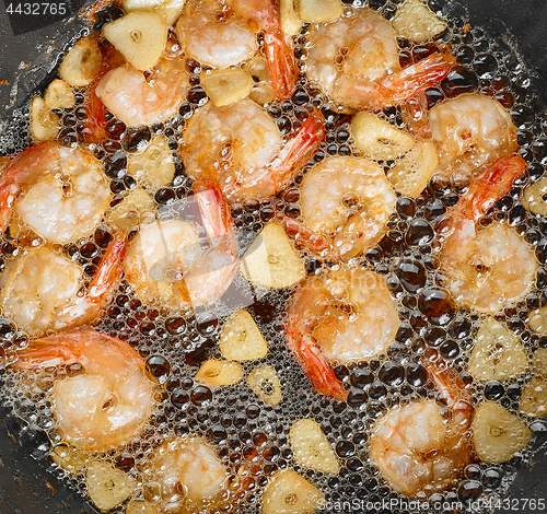 Image of frying garlic prawns