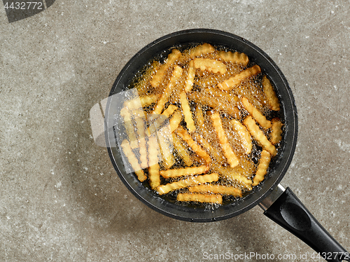 Image of frying potatoes in a pan