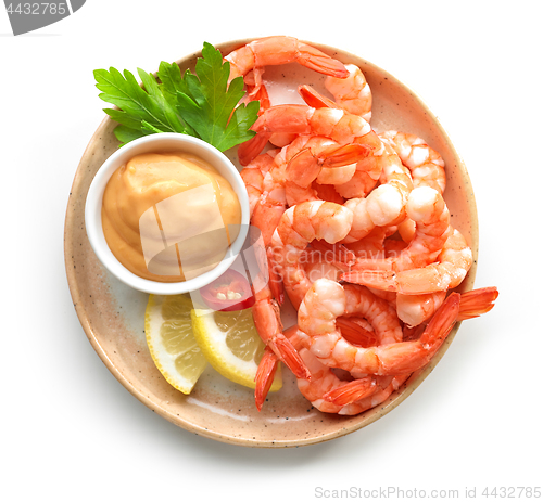 Image of plate of boiled prawns and salsa sauce