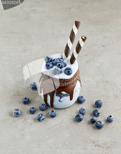 Image of dessert of frozen banana, icecream and blueberries