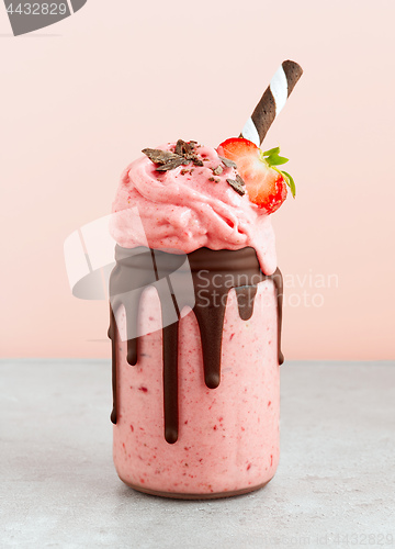 Image of dessert of frozen banana, icecream and strawberries