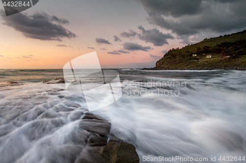 Image of Dawn sky rock flows Garie Beach