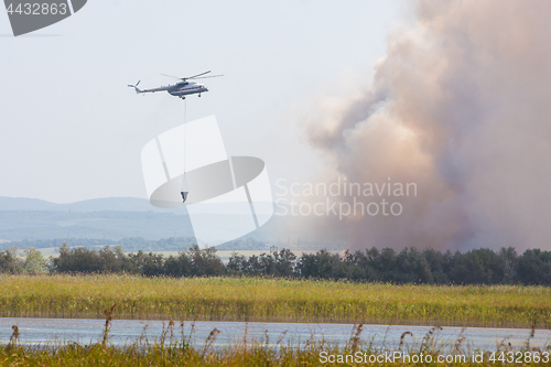 Image of Fire extinguishing using a helicopter MI8