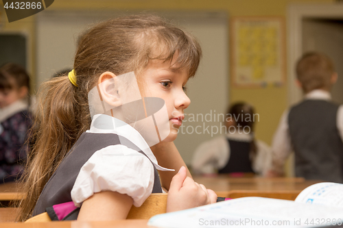 Image of The girl is a first grader at the break in the school class